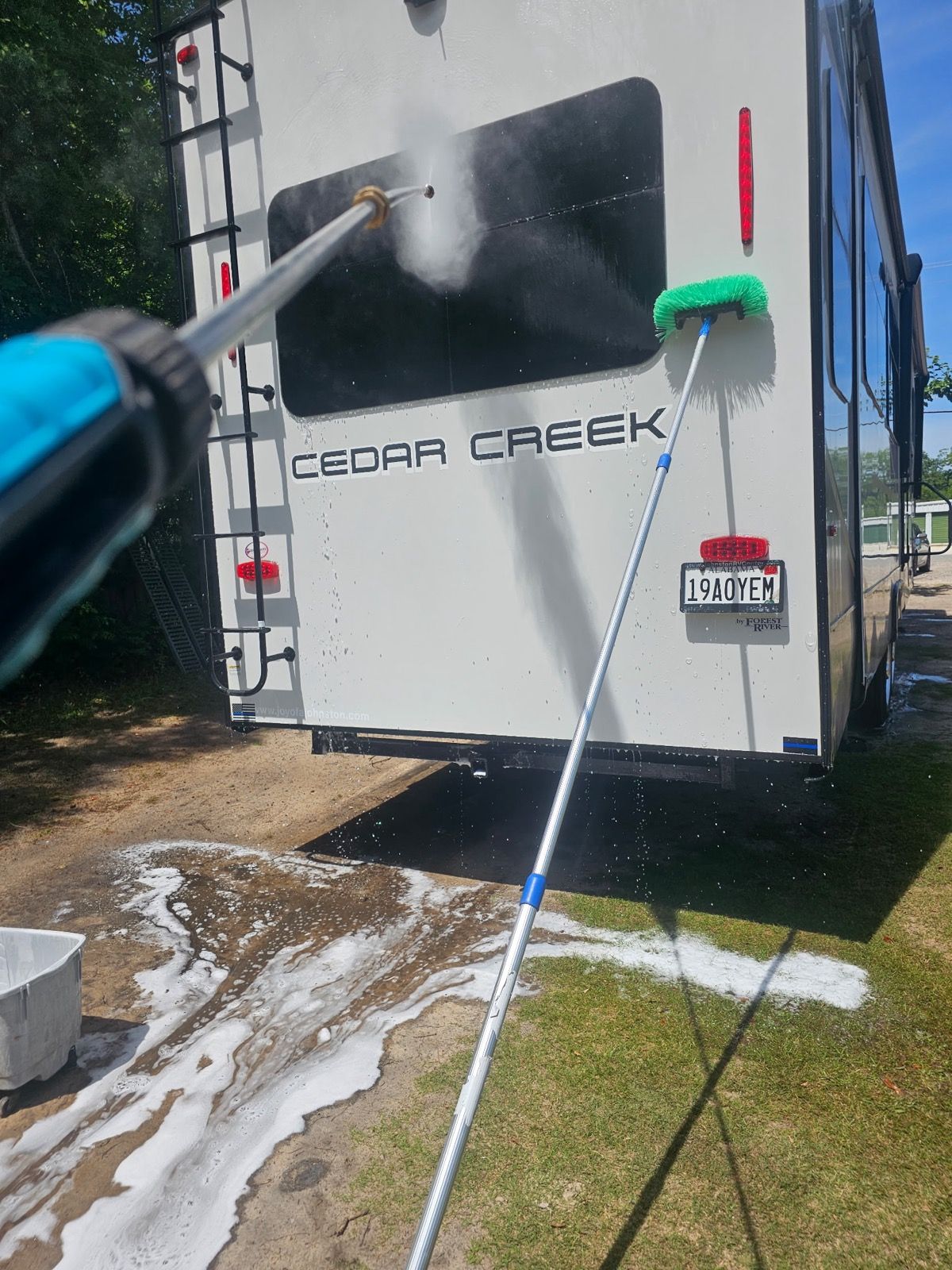 Travel trailer being washed