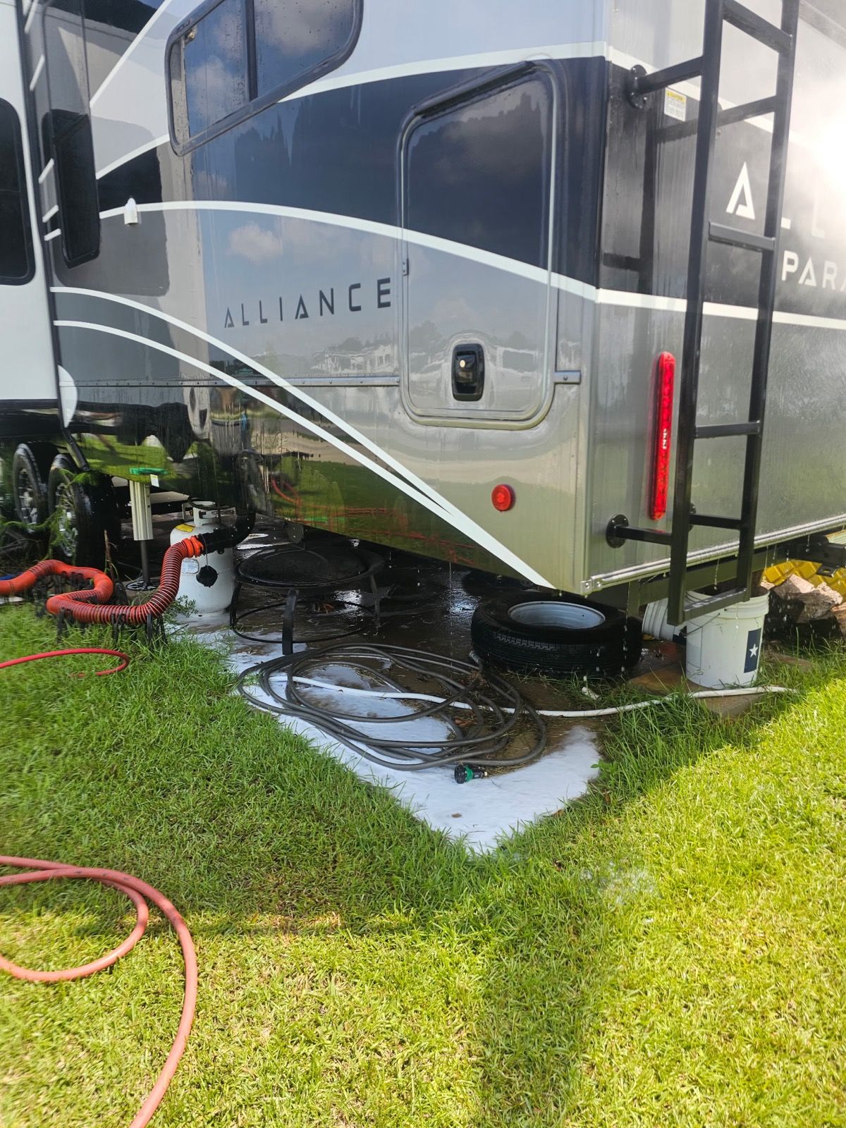 Fifth wheel trailer being washed