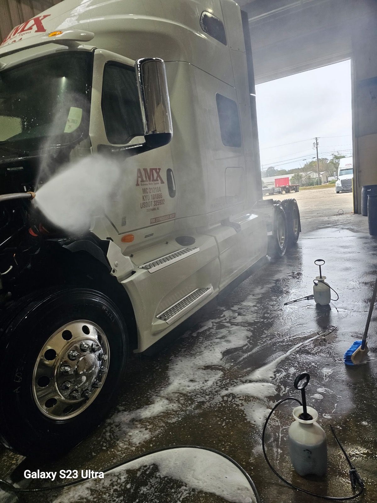 Semi truck being pressure washed